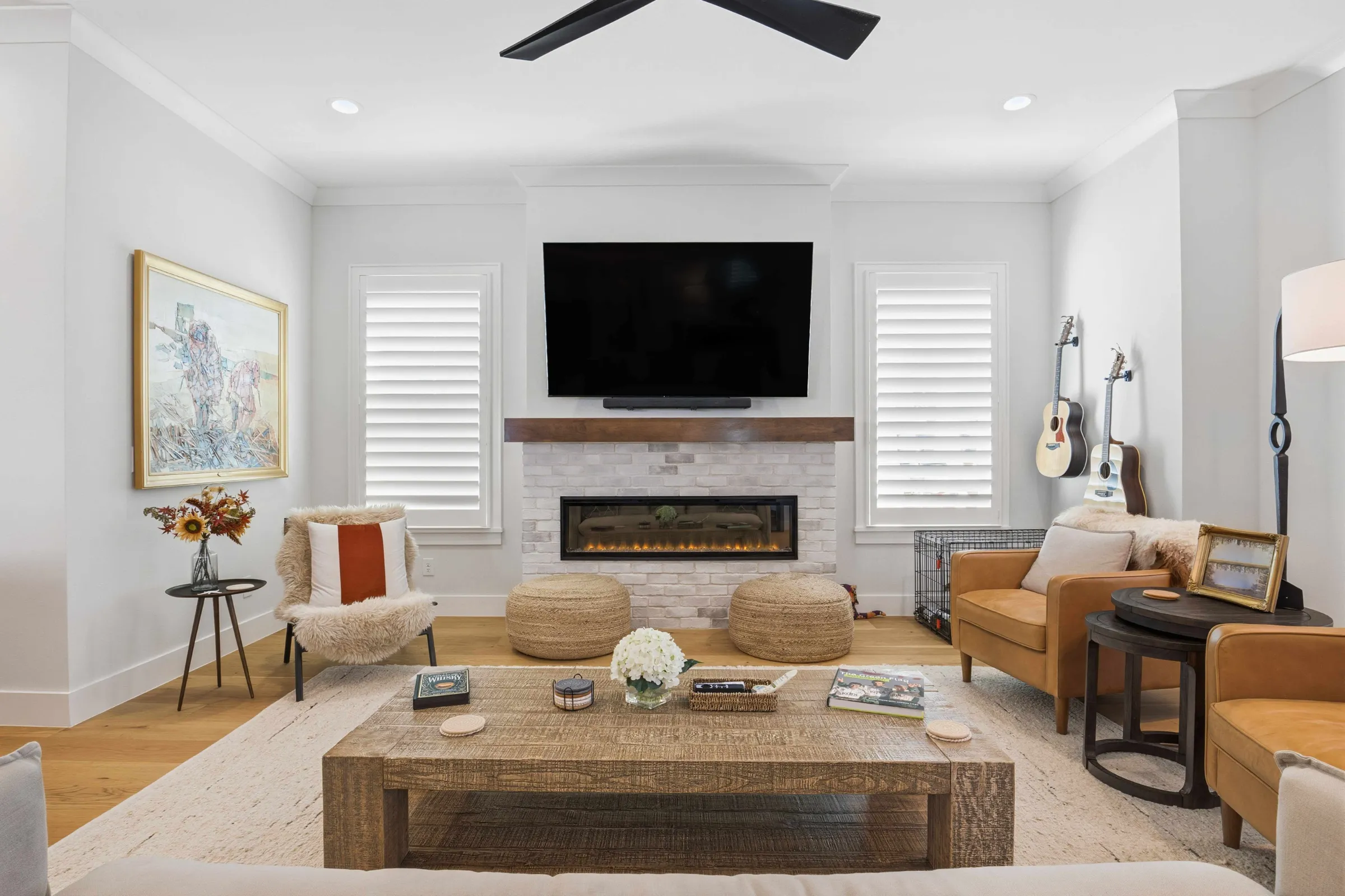 Warm living room with fireplace real estate interior photography by REMIX, Central Florida