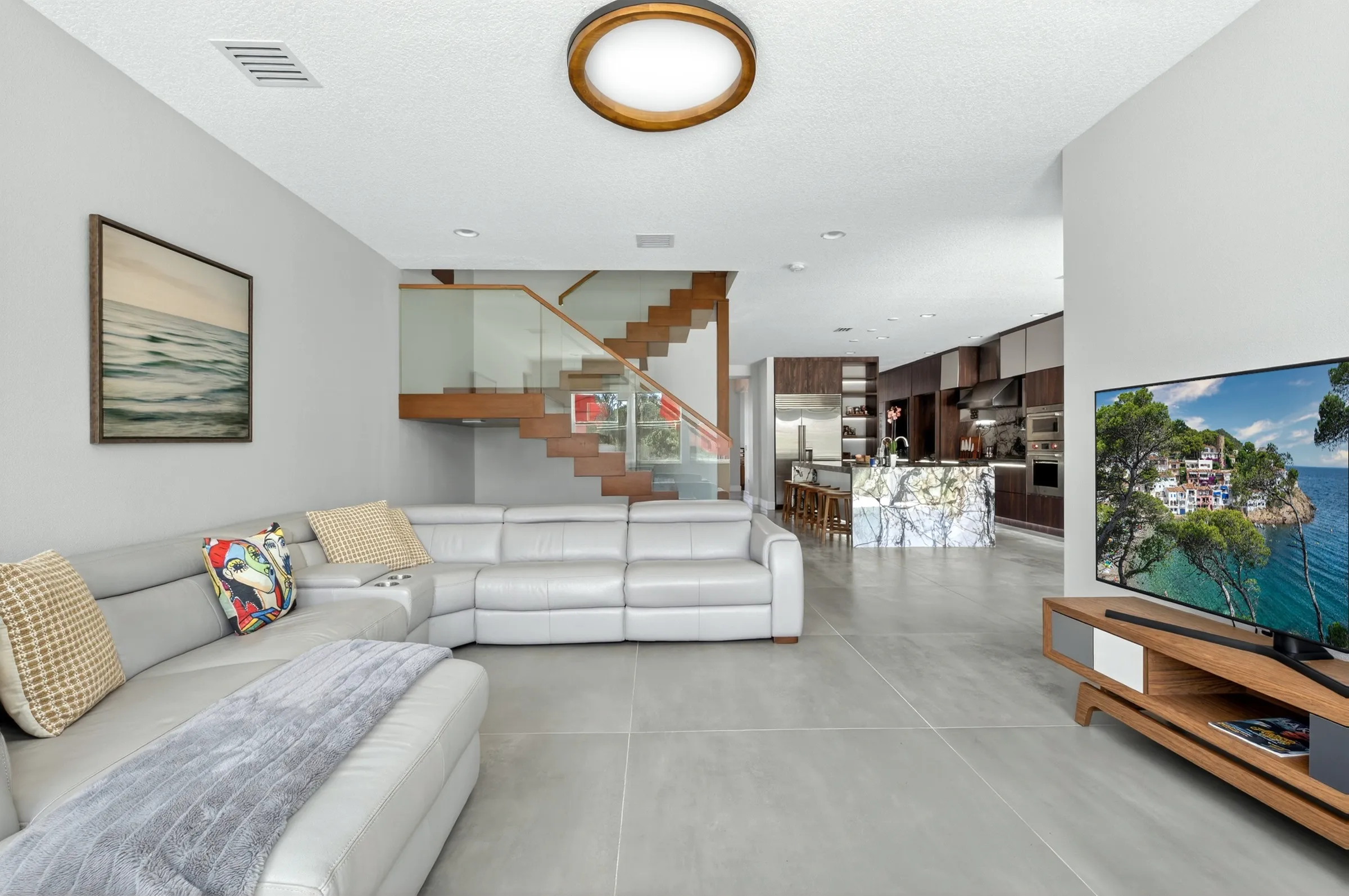 Pro real estate media package - modern open plan living room and kitchen interior photography by REMIX, Central Florida real estate photographer